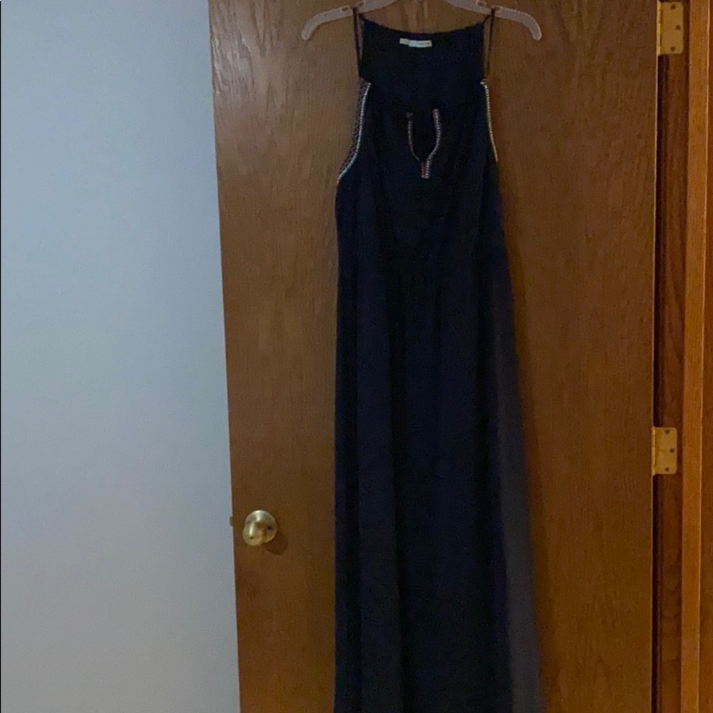 Navy blue maxi dress with neck/arm detail.